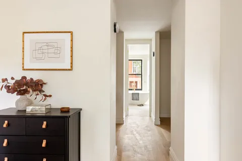 a view of a hallway with closet