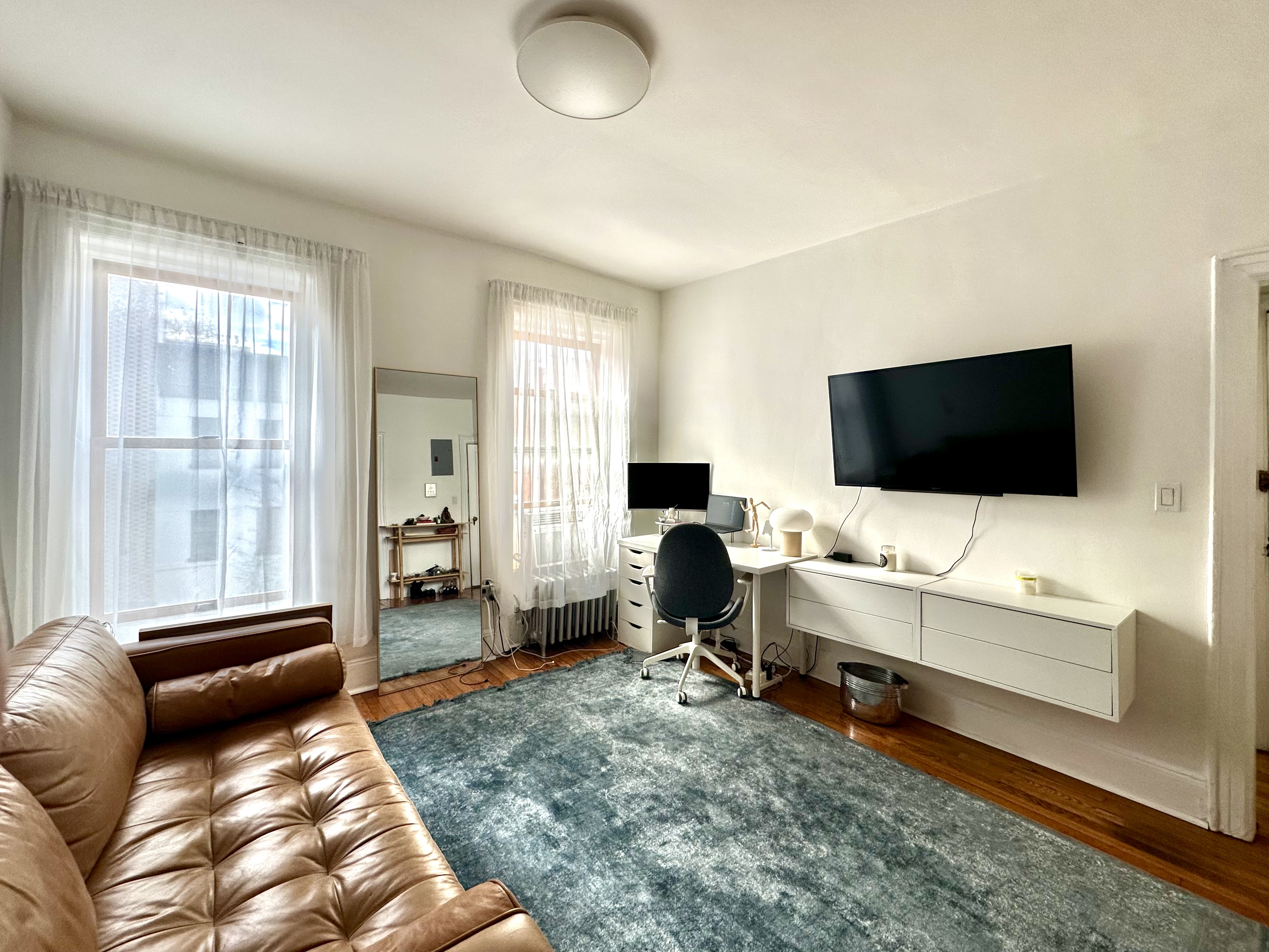 85 Bergen Street, Unit 2C Brooklyn, NY 11201 - Photo 4 of 6 a living room with furniture and a flat screen tv