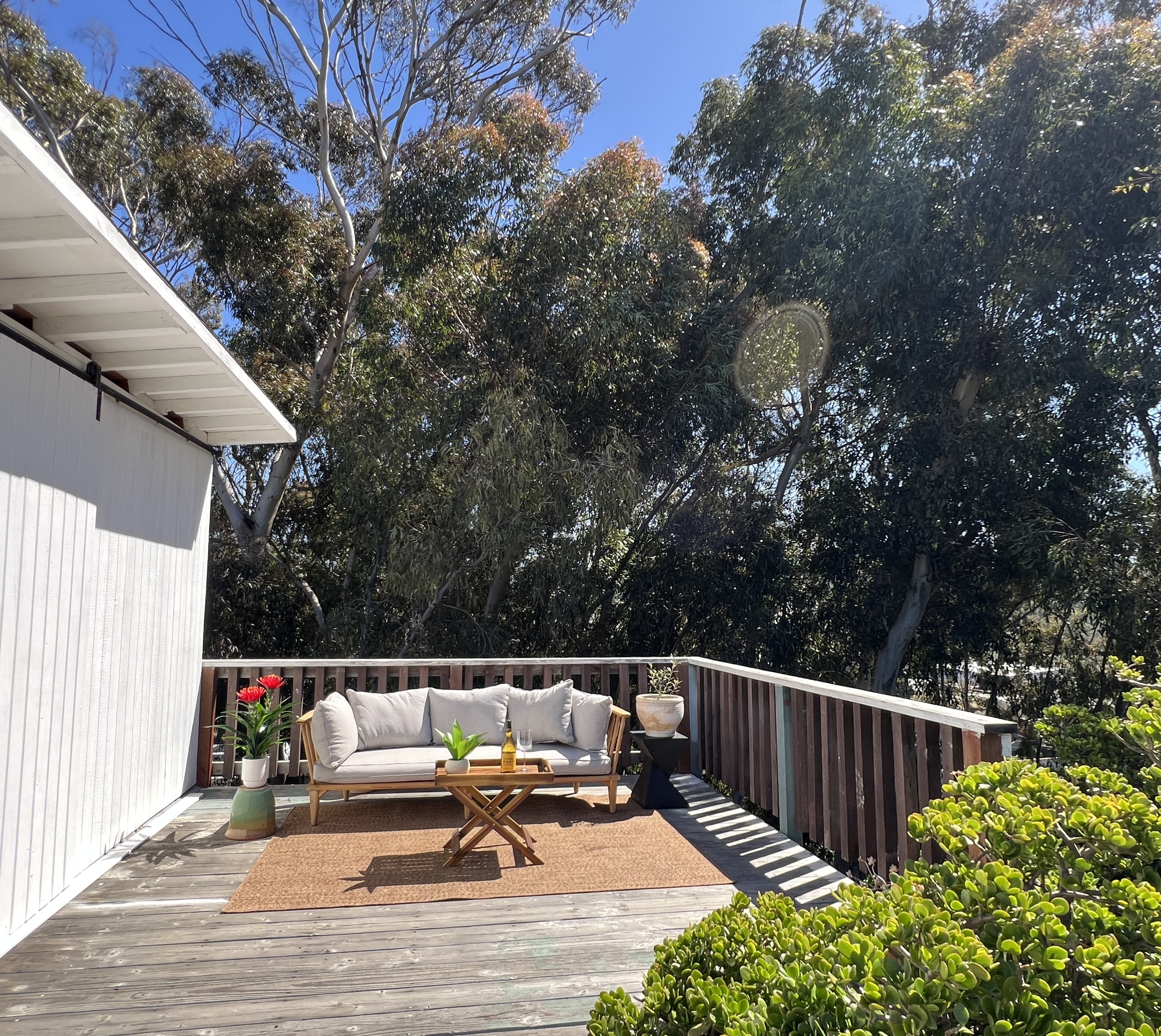 534 Hoover Street Oceanside, CA 92054 - Photo 21 of 31 a balcony with wooden floors and bench