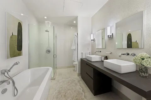 a bathroom with a tub sink double and mirror