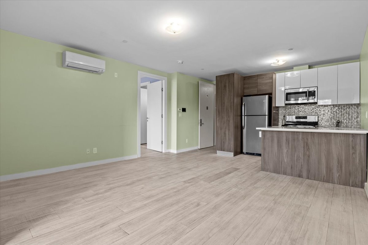 1972 Ocean Avenue, Unit 4A Brooklyn, NY 11230 - Photo 8 of 18 a view of a kitchen with a sink and a refrigerator