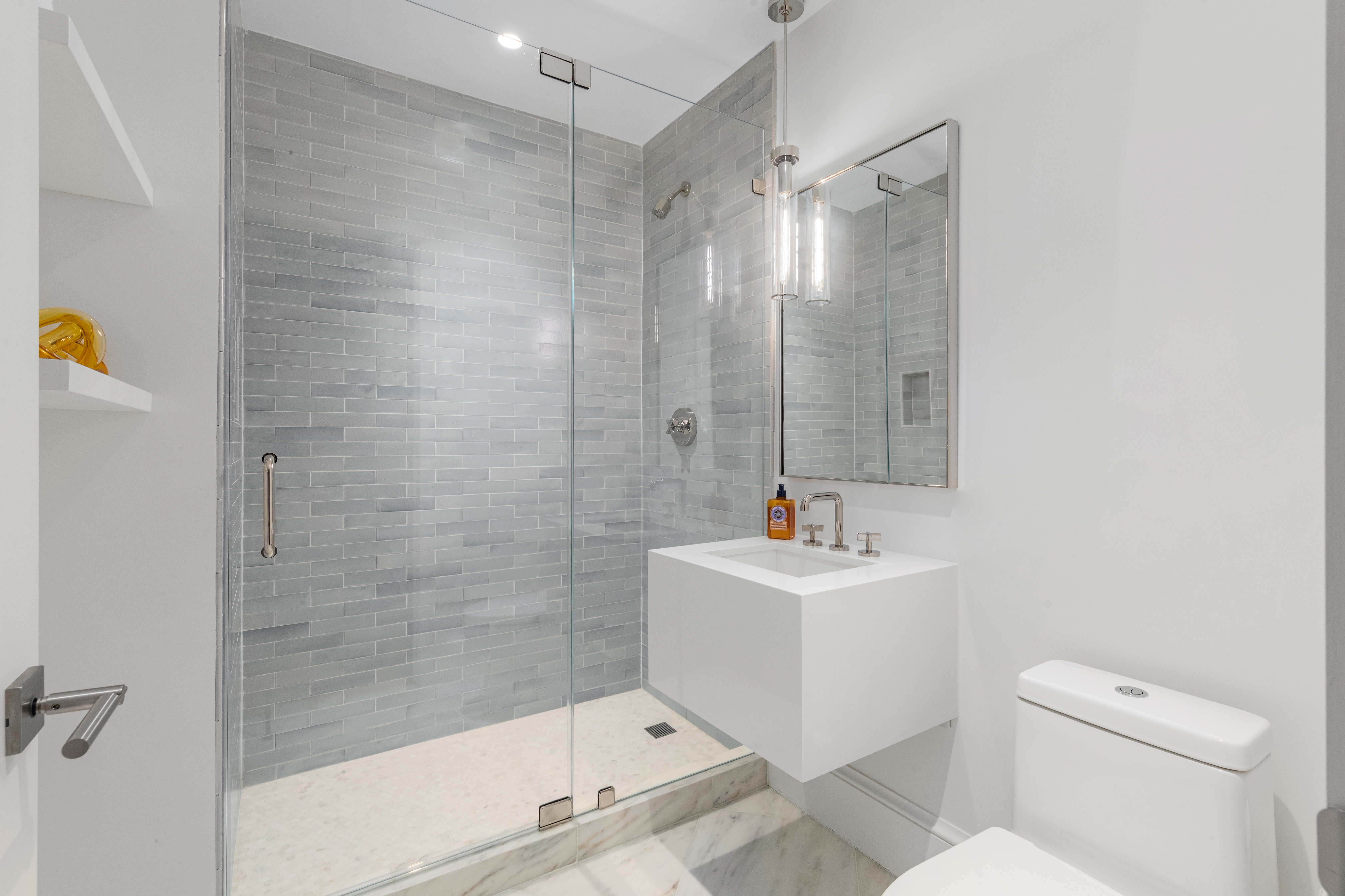 51 Warren Street, Unit 3W Manhattan, NY 10007 - Photo 12 of 13 a bathroom with a sink toilet and shower