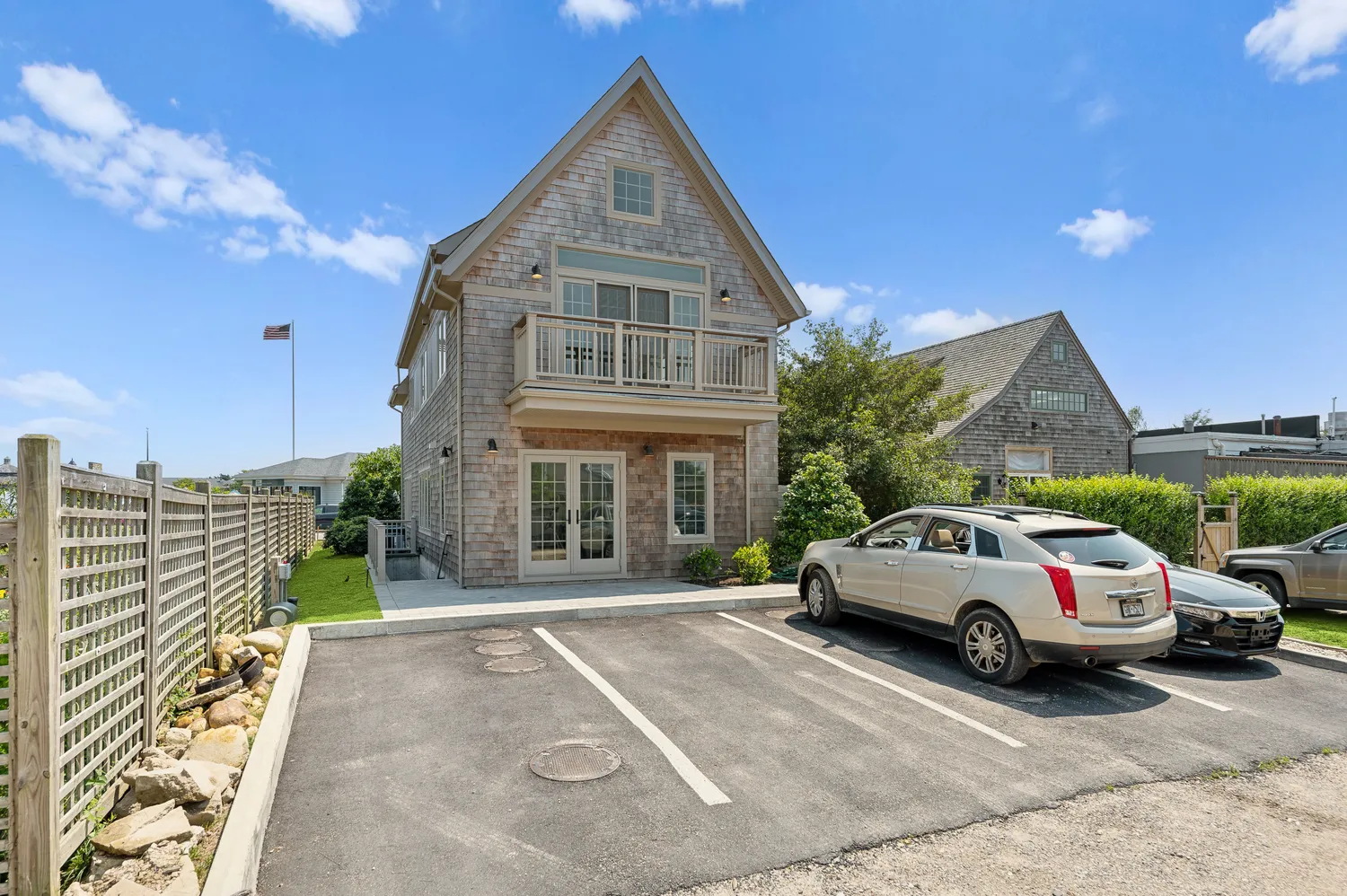 a view of empty room with a window and wooden floor