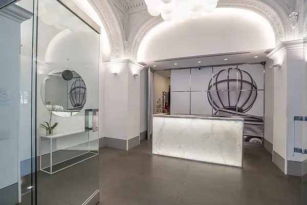 a picture of a elevator with wooden door