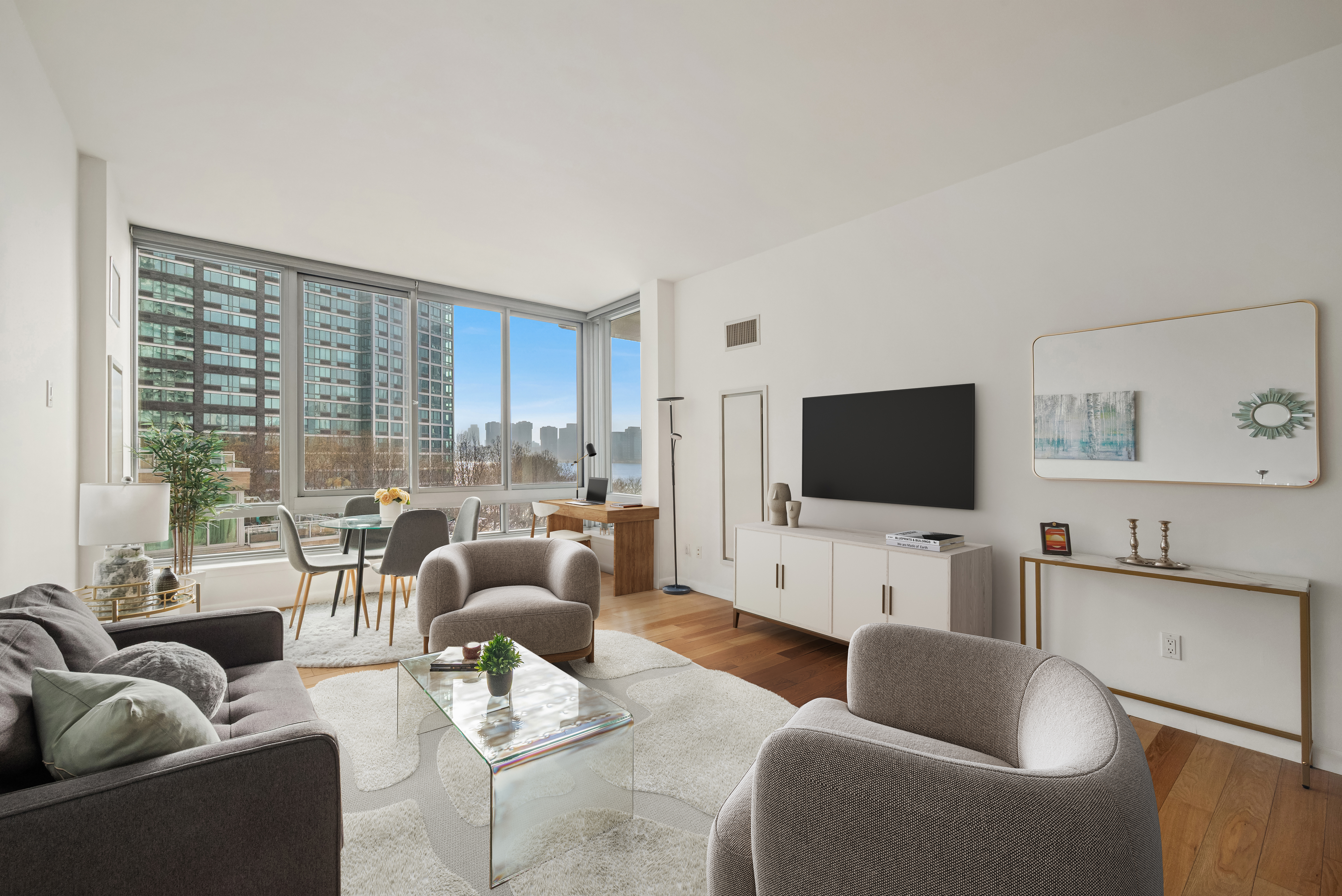 a living room with furniture and a flat screen tv
