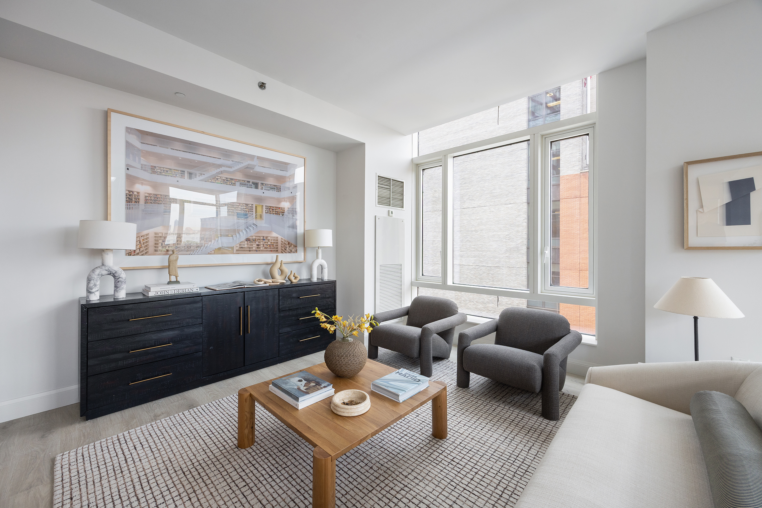 70 Little West Street, Unit 7L Manhattan, NY 10004 - Photo 5 of 25 a living room with furniture rug and window