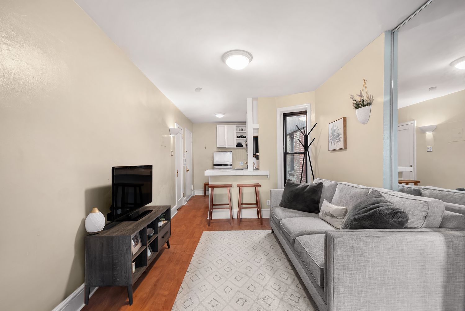 a living room with furniture and a flat screen tv