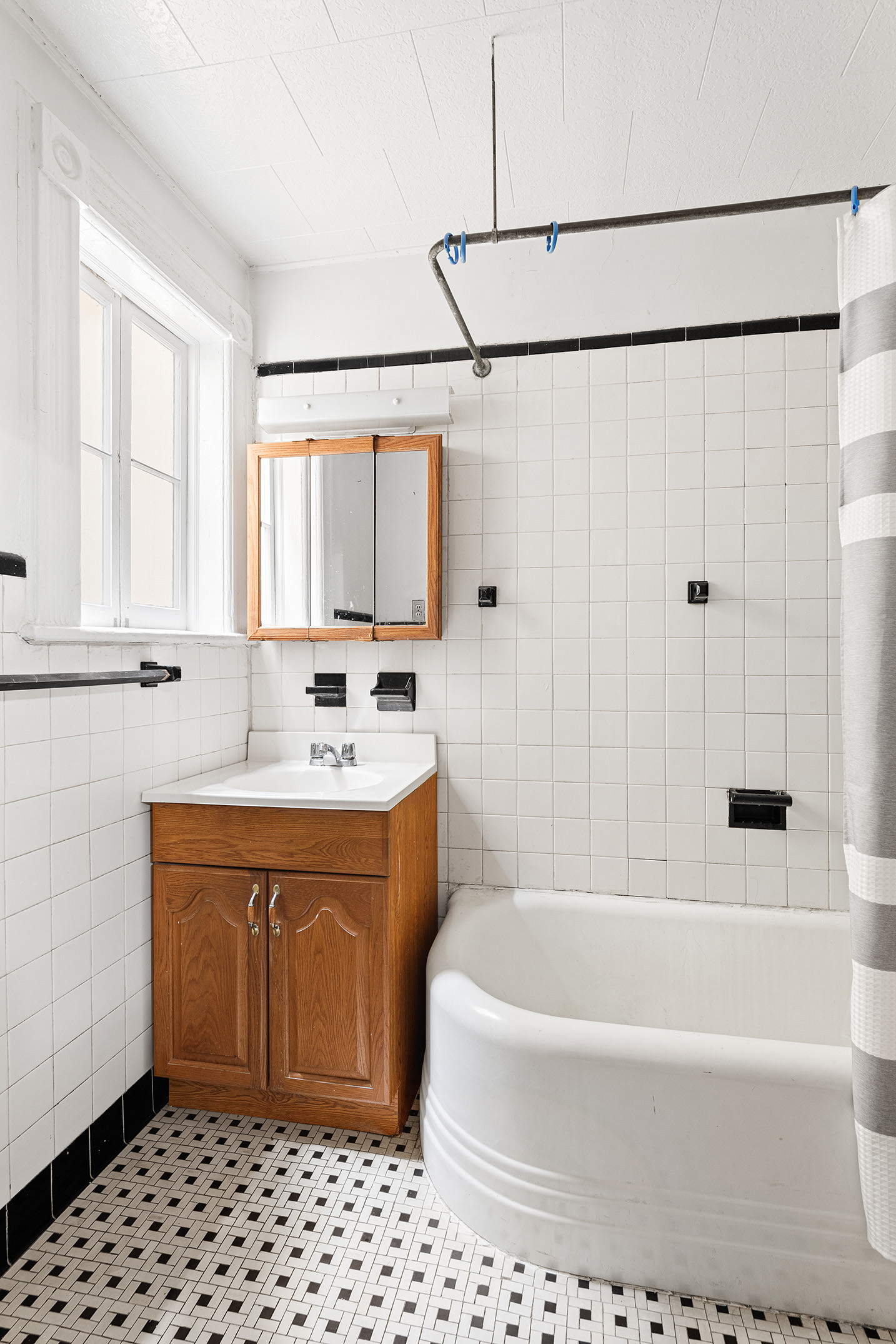 80 7th Avenue Brooklyn, NY 11217 - Photo 6 of 8 a bathroom with a bathtub and a sink