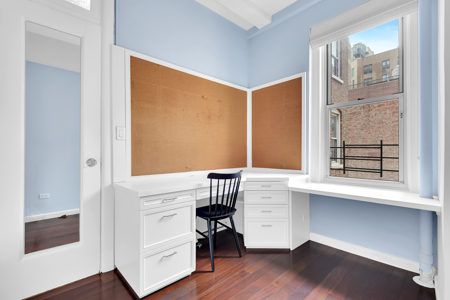 122 East 82nd Street, Unit 8C Manhattan, NY 10028 - Photo 11 of 15 a view of kitchen with furniture and a window