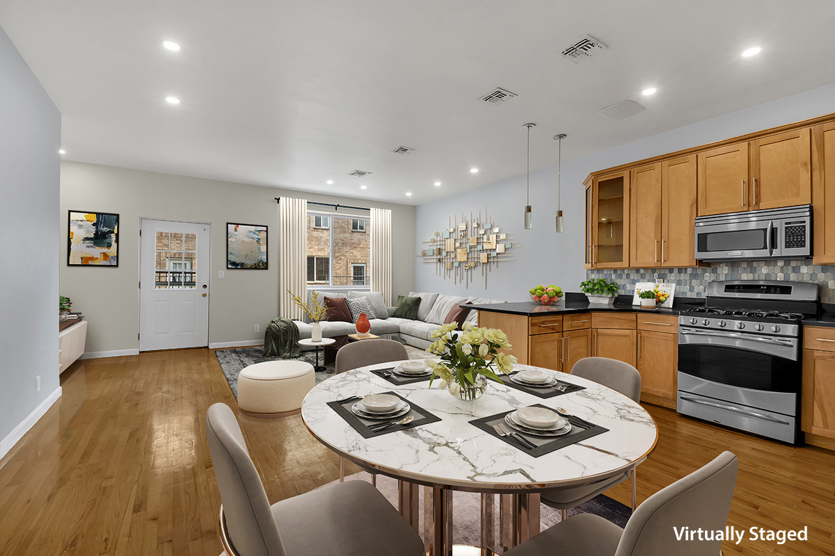 963 Kent Avenue, Unit D3 Brooklyn, NY 11205 - Photo 3 of 16 a view of kitchen with granite countertop stove top oven dining table and chairs