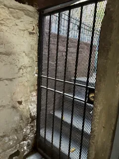 a bed sitting in front of a window