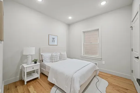 a bedroom with a bed and a table