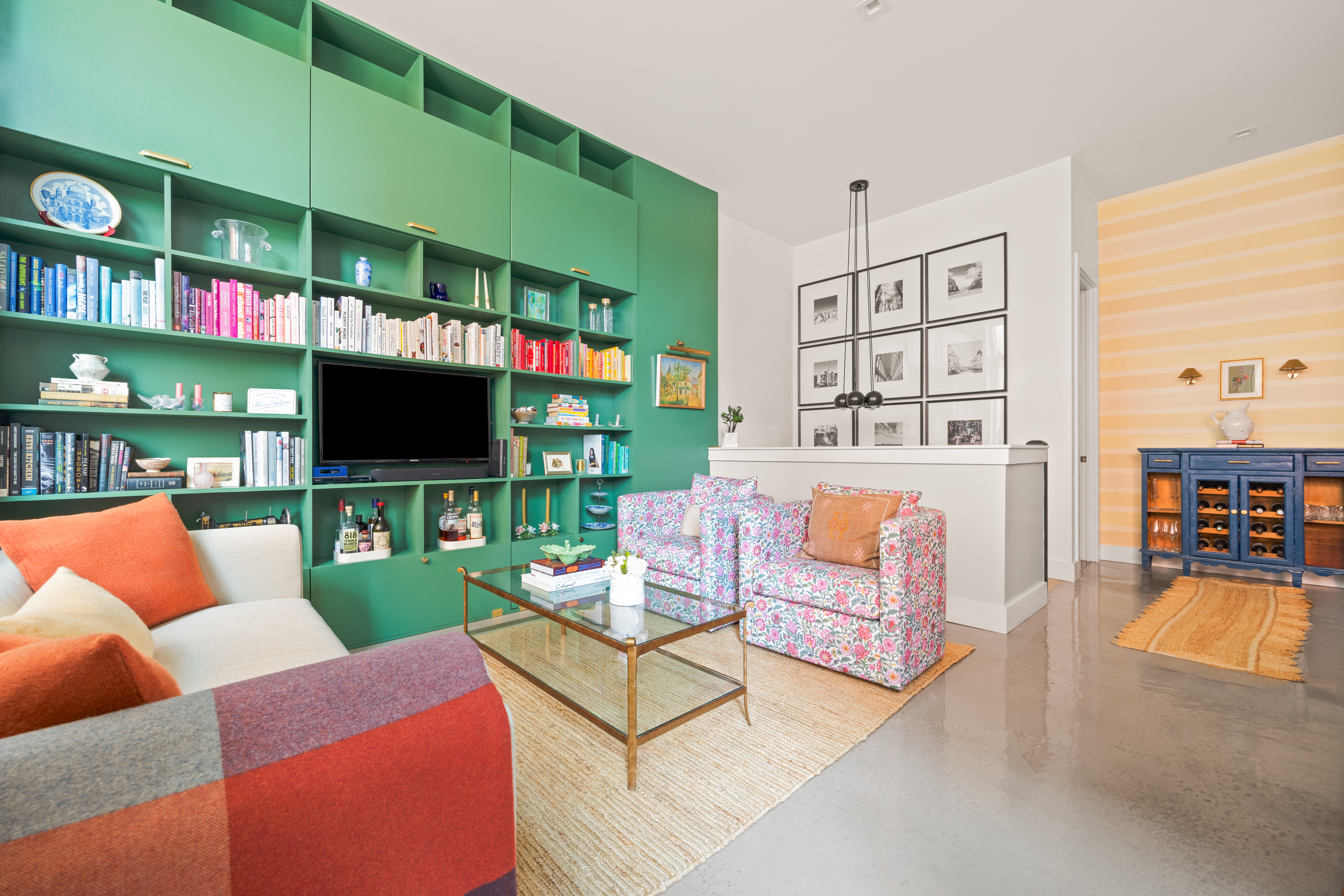 622 Grand Avenue, Unit 103 Brooklyn, NY 11238 - Photo 3 of 19 a living room with furniture a flat screen tv and a floor to ceiling window
