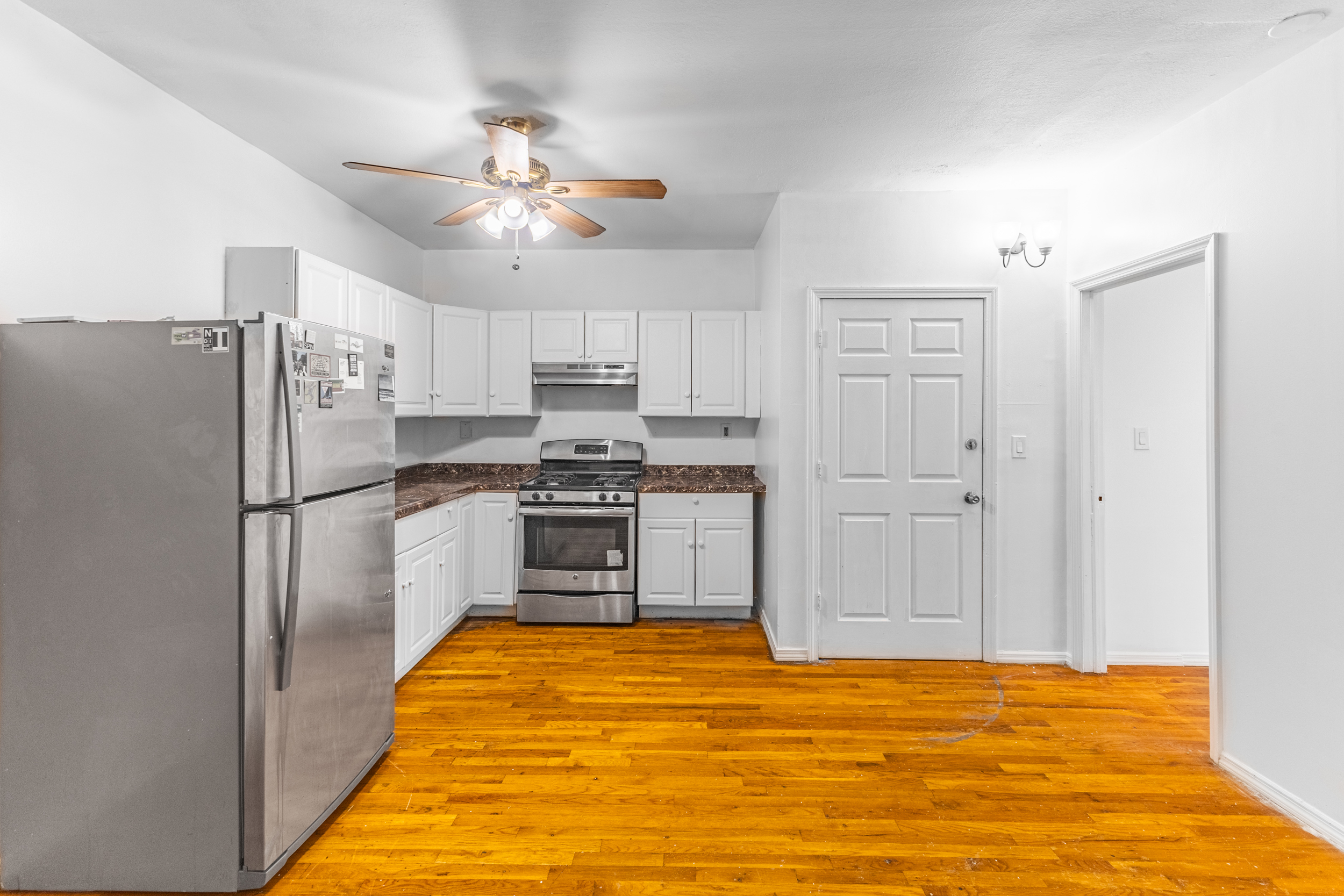 434 Lexington Avenue Brooklyn, NY 11221 - Photo 11 of 22 a kitchen with stainless steel appliances a refrigerator and a stove top oven