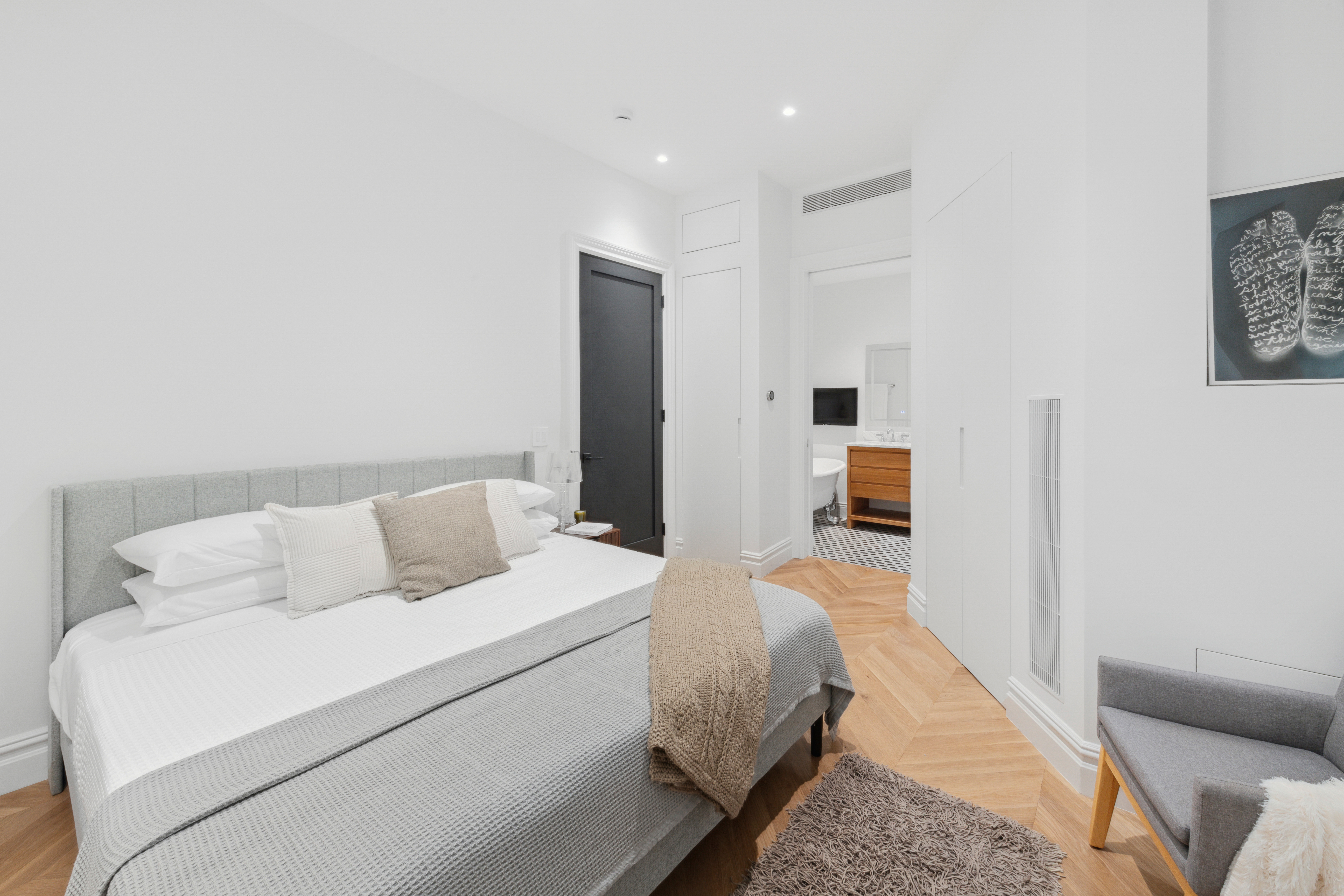 33 West 67th Street, Unit 4M Manhattan, NY 10023 - Photo 8 of 16 a bed room with a bed and a couch