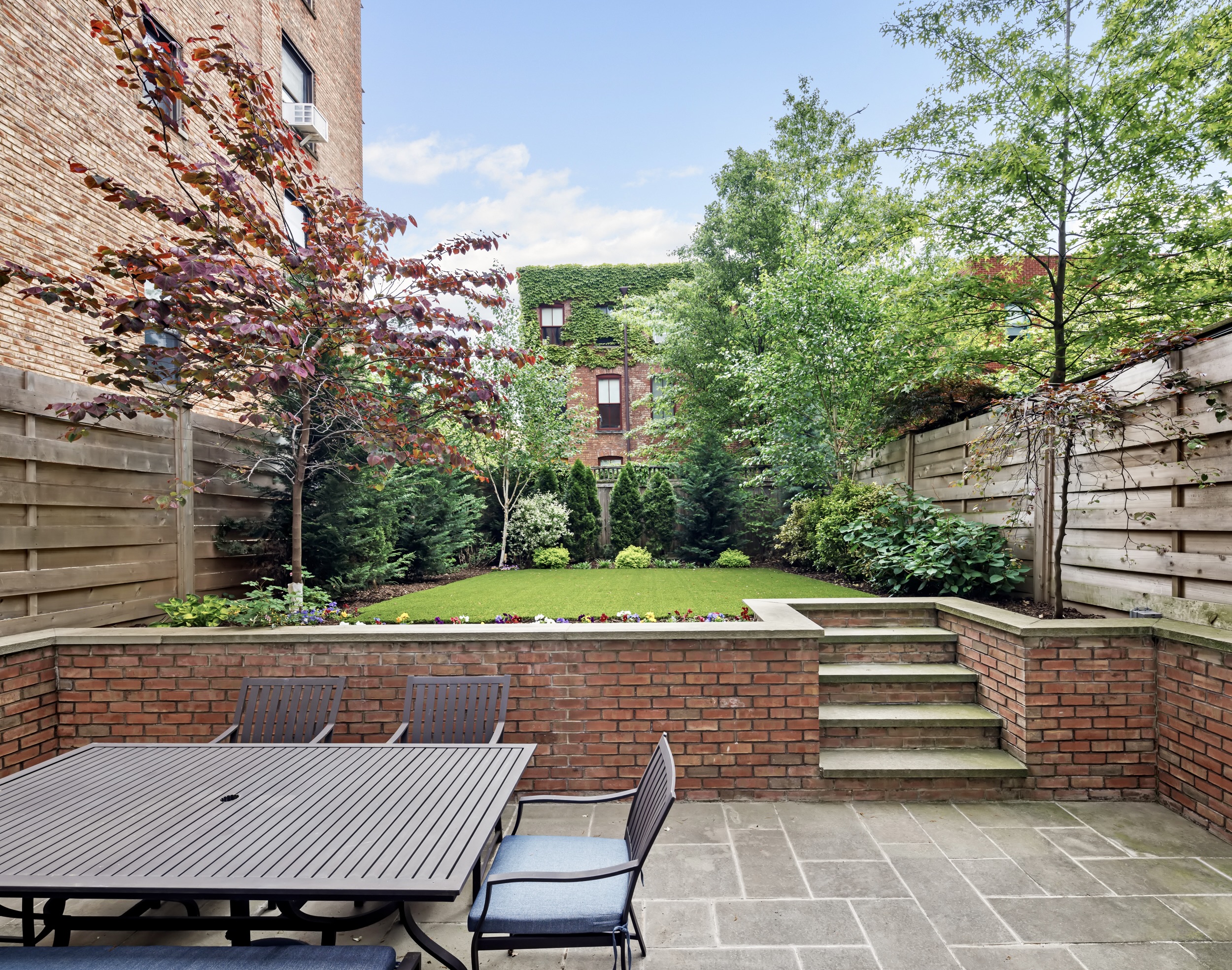 435 Clinton Avenue Brooklyn, NY 11238 - Photo 10 of 27 a view of a patio with table and chairs and potted plants