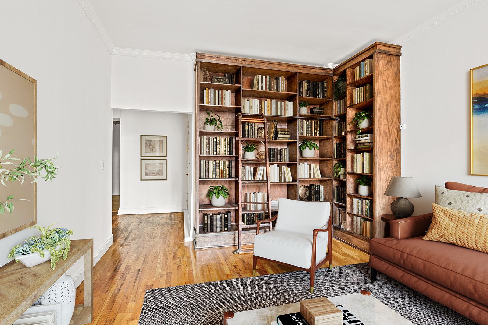 689 Fort Washington Avenue, Unit 1AA Manhattan, NY 10040 - Photo 2 of 13 a living room with furniture and a book shelf