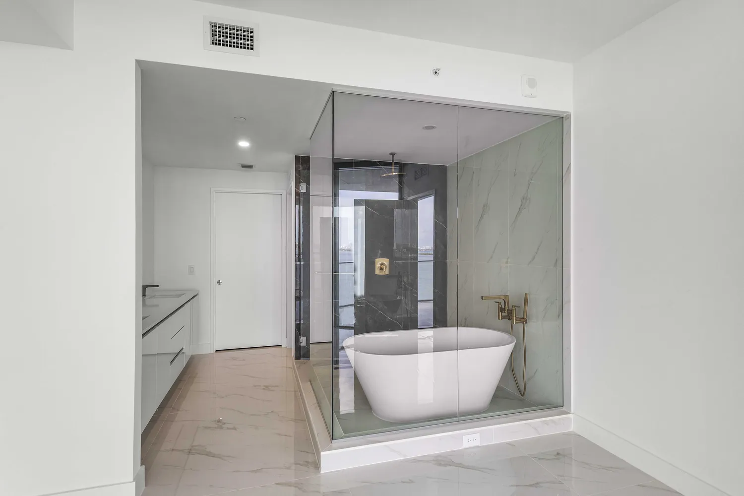 a view of walk in closet with empty racks