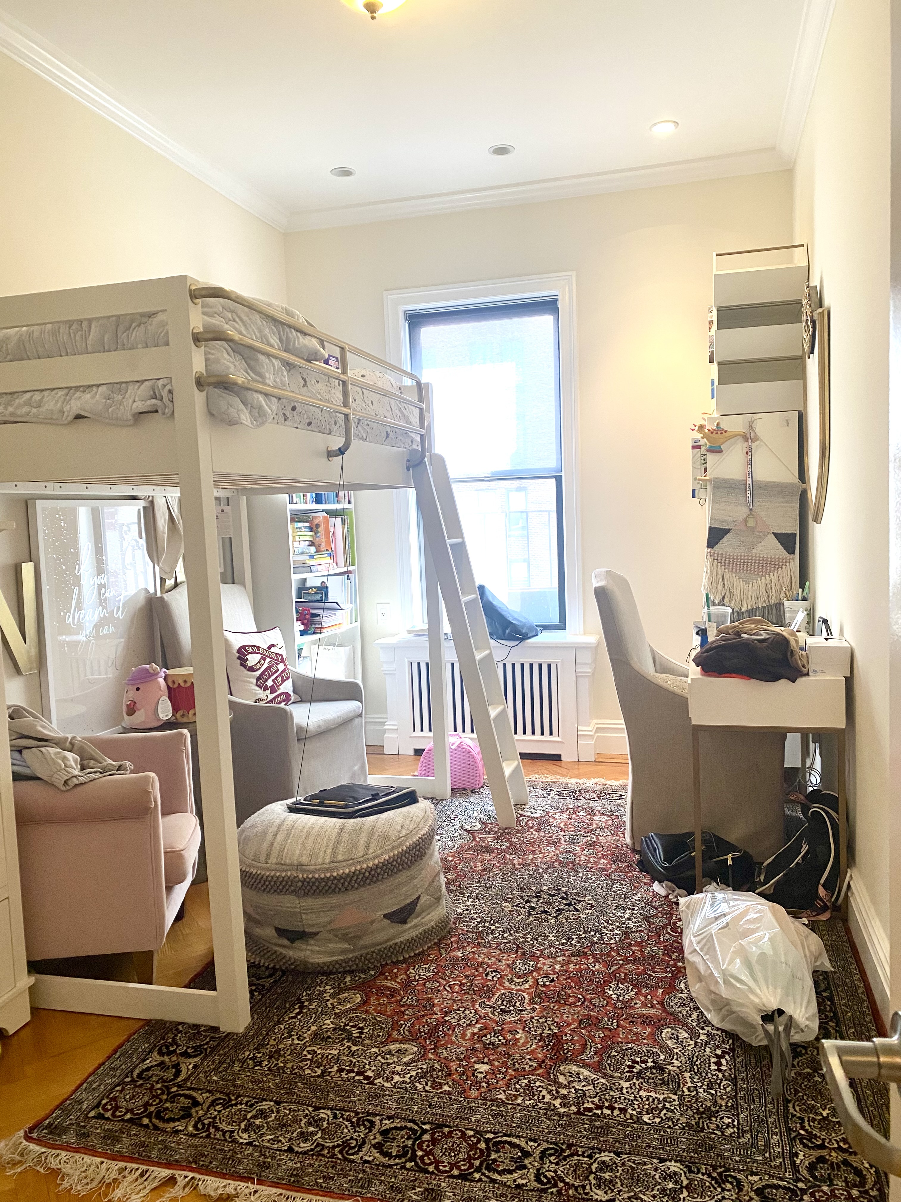1240 Park Avenue, Unit 6B Manhattan, NY 10128 - Photo 10 of 13 a living room with furniture a window and a table