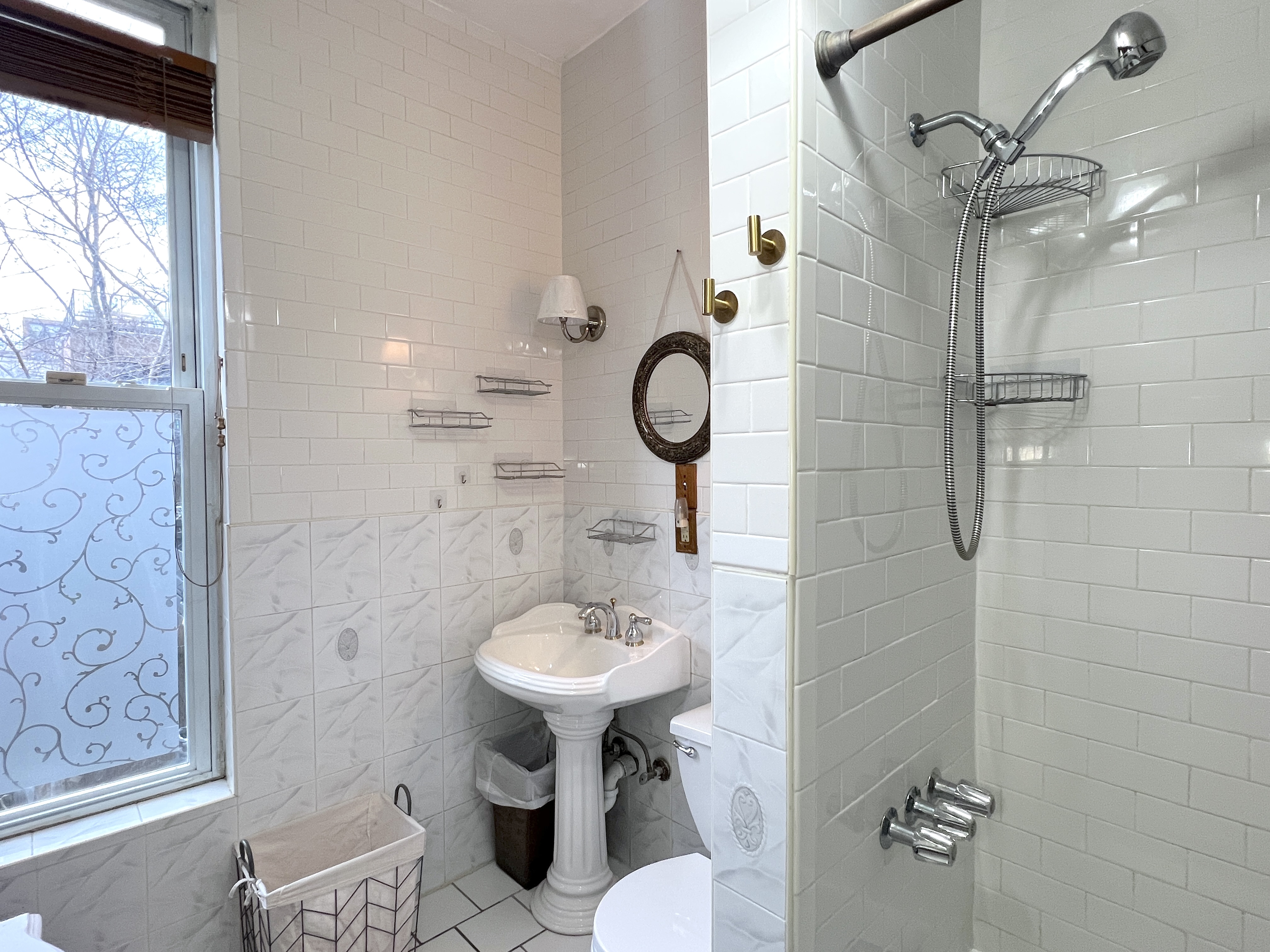 545 A Lafayette Avenue, Unit 2 Brooklyn, NY 11205 - Photo 7 of 7 a bathroom with a sink toilet and shower