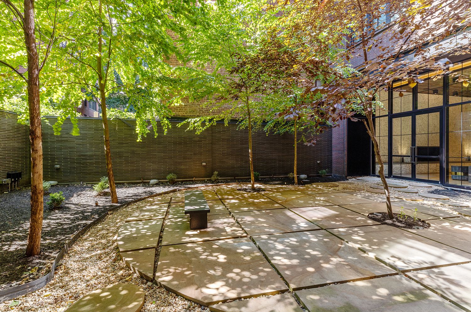 959 1st Avenue, Unit 25H Manhattan, NY 10022 - Photo 15 of 18 a outside view of a house with a yard