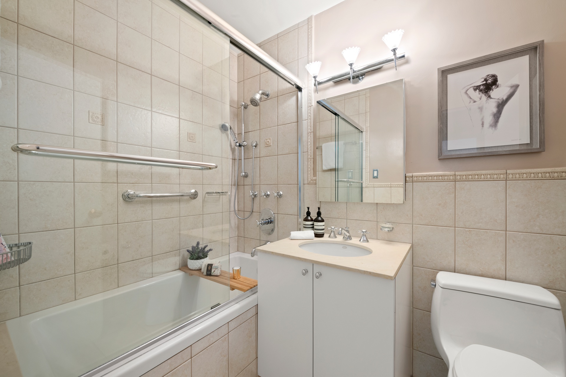 20 East 9th Street, Unit 7V Manhattan, NY 10003 - Photo 12 of 30 a bathroom with a sink a toilet and shower