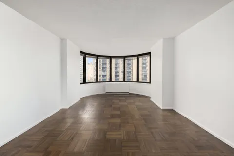 a view of an empty room with windows
