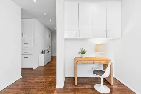 a room with furniture and a wooden floor