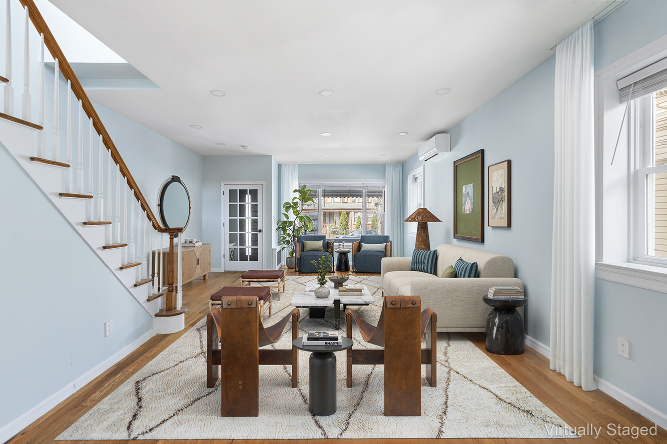 a living room with lots of furniture and a window
