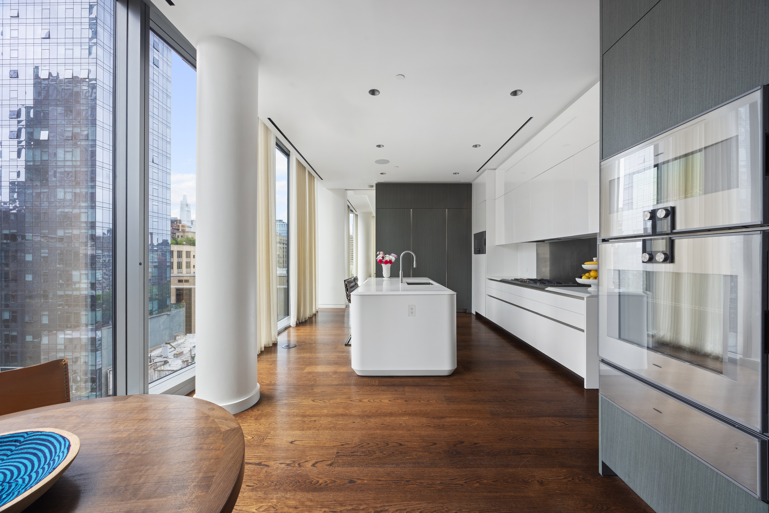 520 West 28th Street, Unit PH37 Manhattan, NY 10001 - Photo 12 of 45 a kitchen with stainless steel appliances granite countertop a refrigerator and a stove