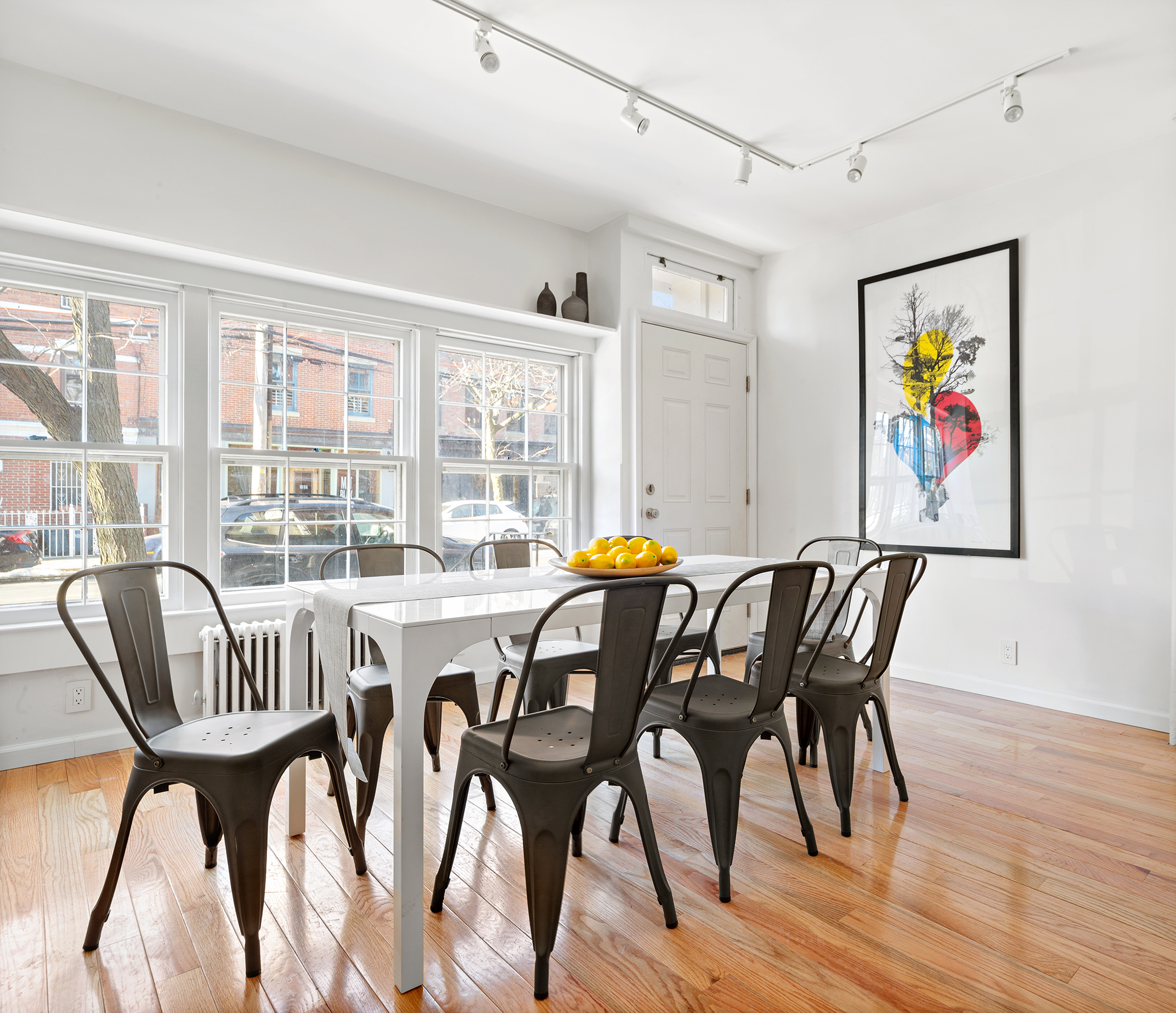375 Van Brunt Street Brooklyn, NY 11231 - Photo 4 of 12 a view of a dining room with furniture a rug and wooden floor
