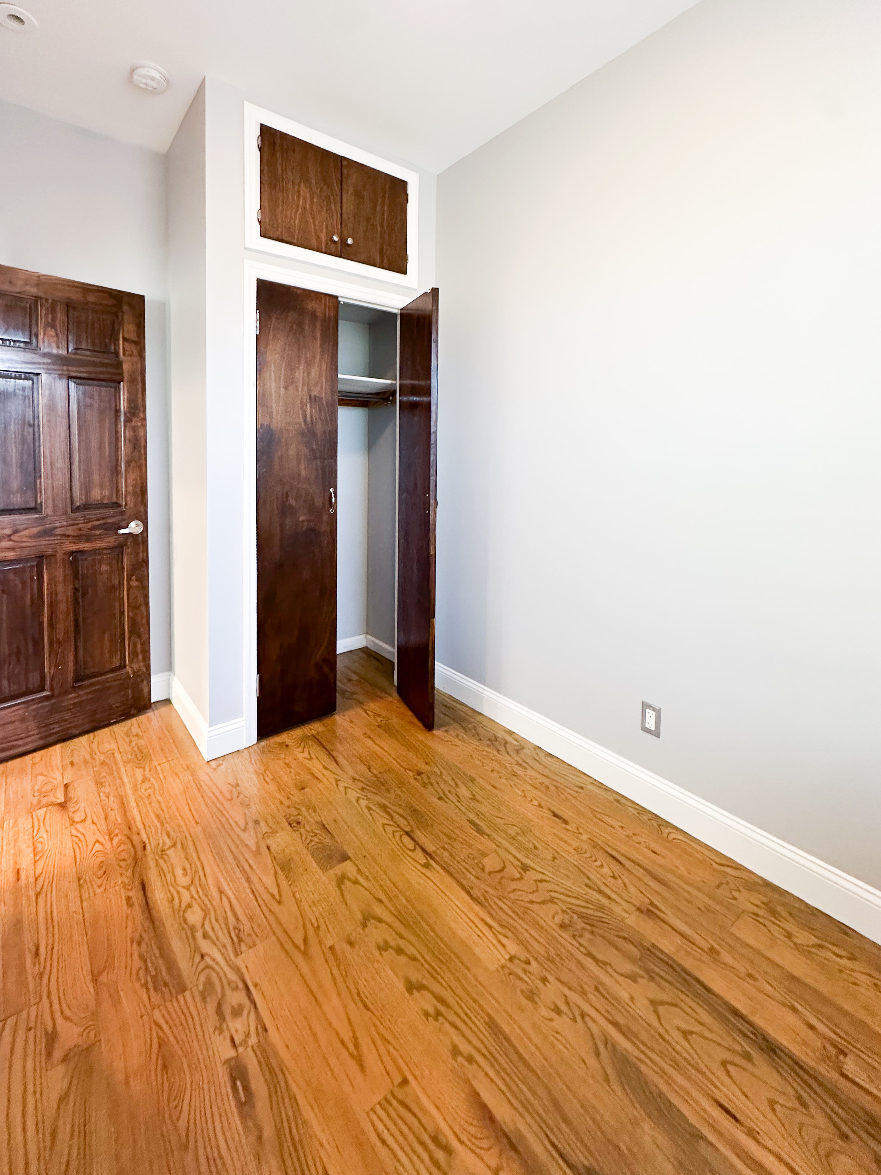 567 New Jersey Avenue, Unit 2 Brooklyn, NY 11207 - Photo 8 of 11 a view of empty room with wooden floor