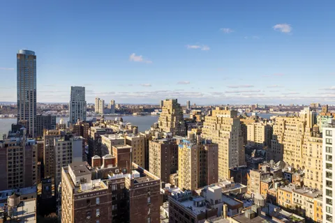 a view of a city with tall buildings