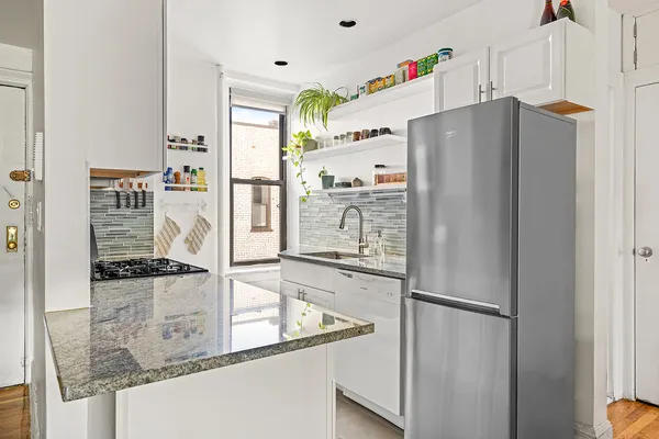 a kitchen with refrigerator and countertop