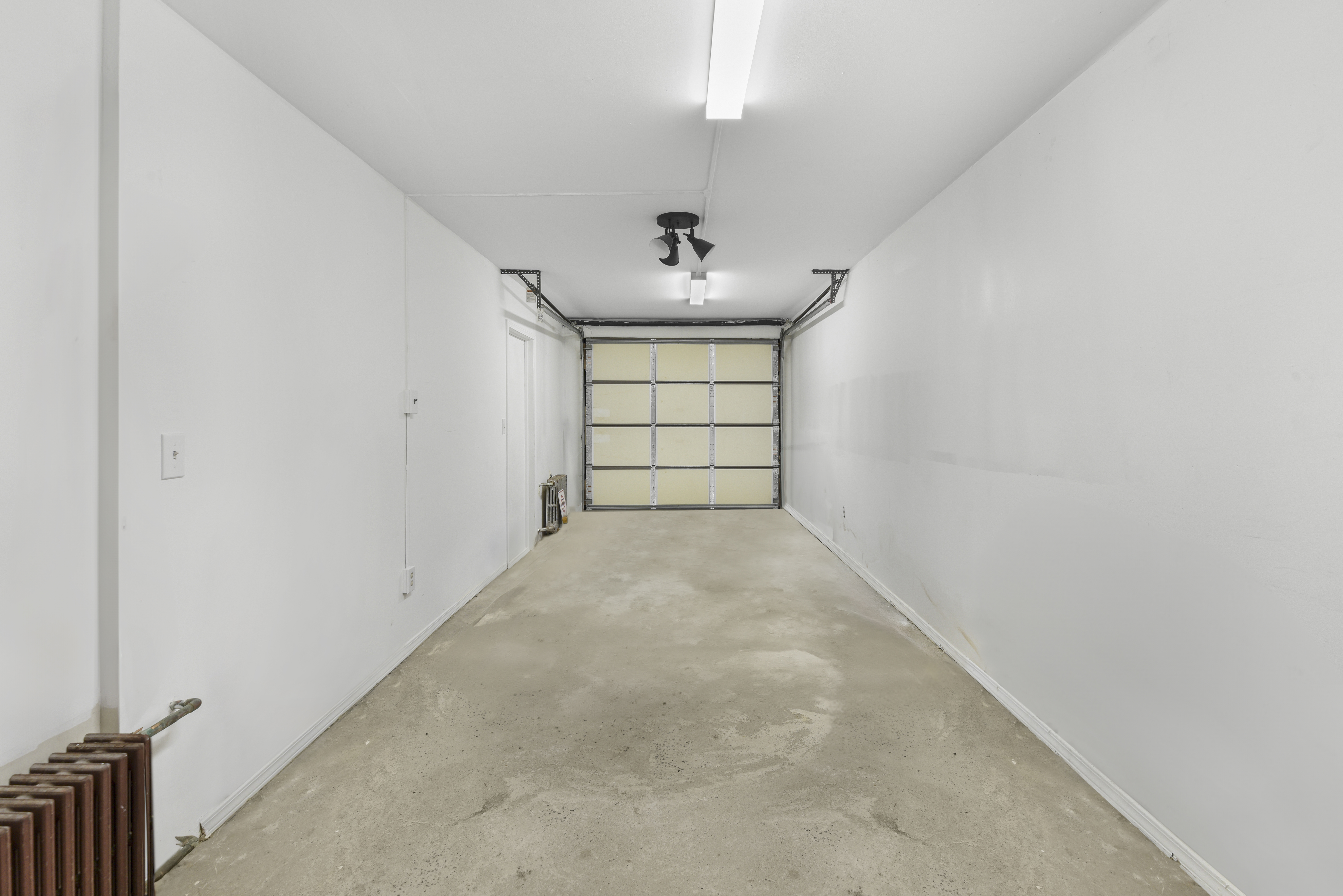 444 Union Street Brooklyn, NY 11231 - Photo 11 of 13 an empty room with windows and cabinet