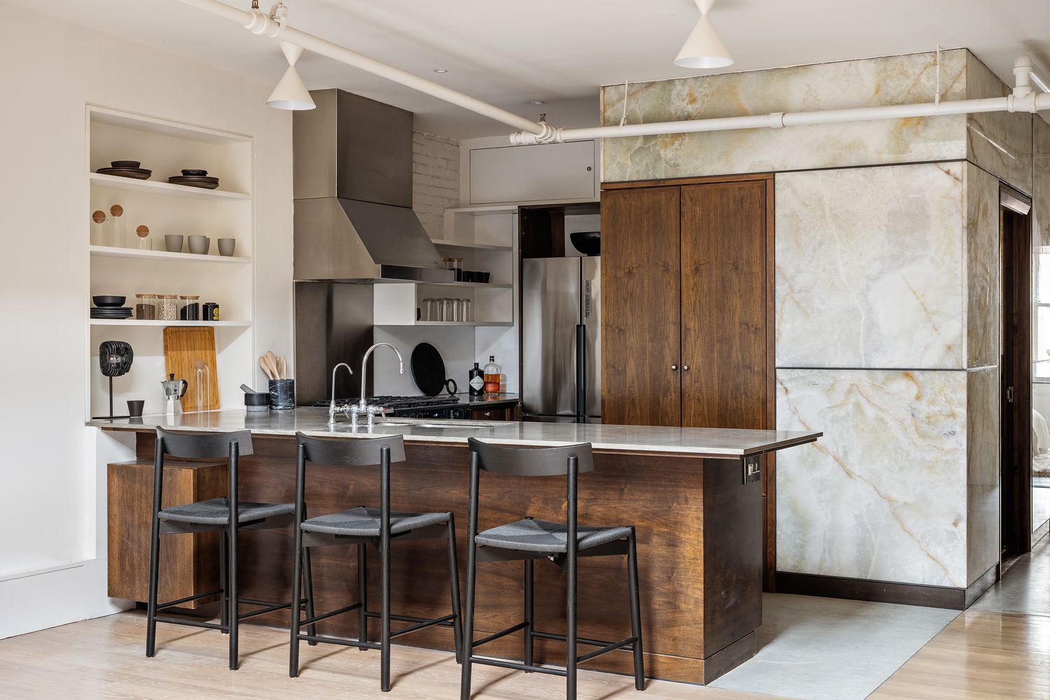a kitchen with stainless steel appliances a refrigerator and cabinets
