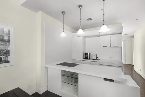a bathroom with a sink a toilet a shower and a mirror