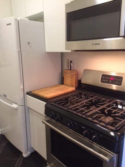 222 Riverside Drive, Unit PH2E Manhattan, NY 10025 - Photo 11 of 18 a stove top oven sitting inside of a kitchen