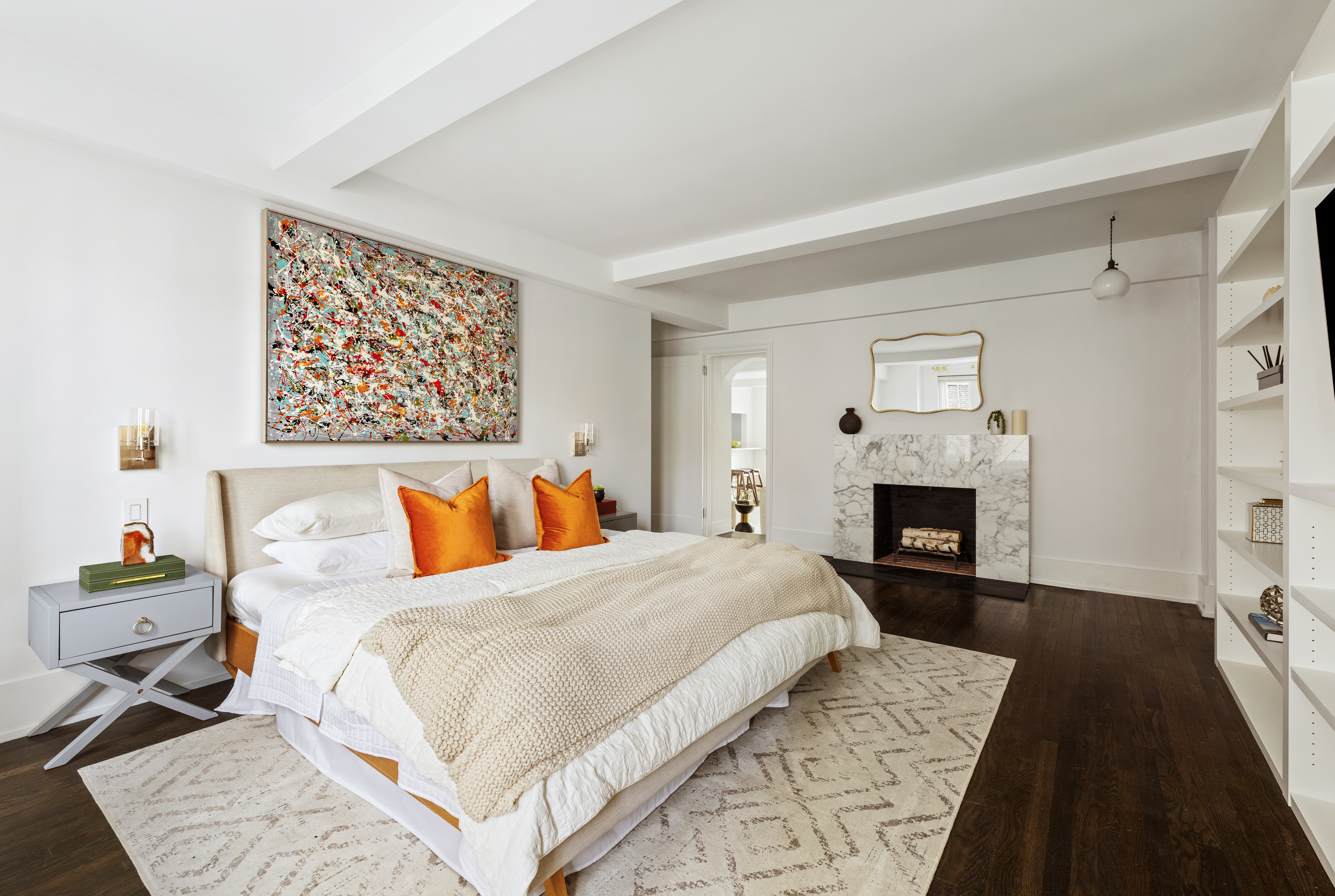 299 West 12th Street, Unit 7BC Manhattan, NY 10014 - Photo 7 of 16 a bed room with a bed and a fireplace