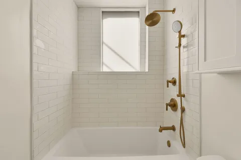 a close up of a bathtub curtain