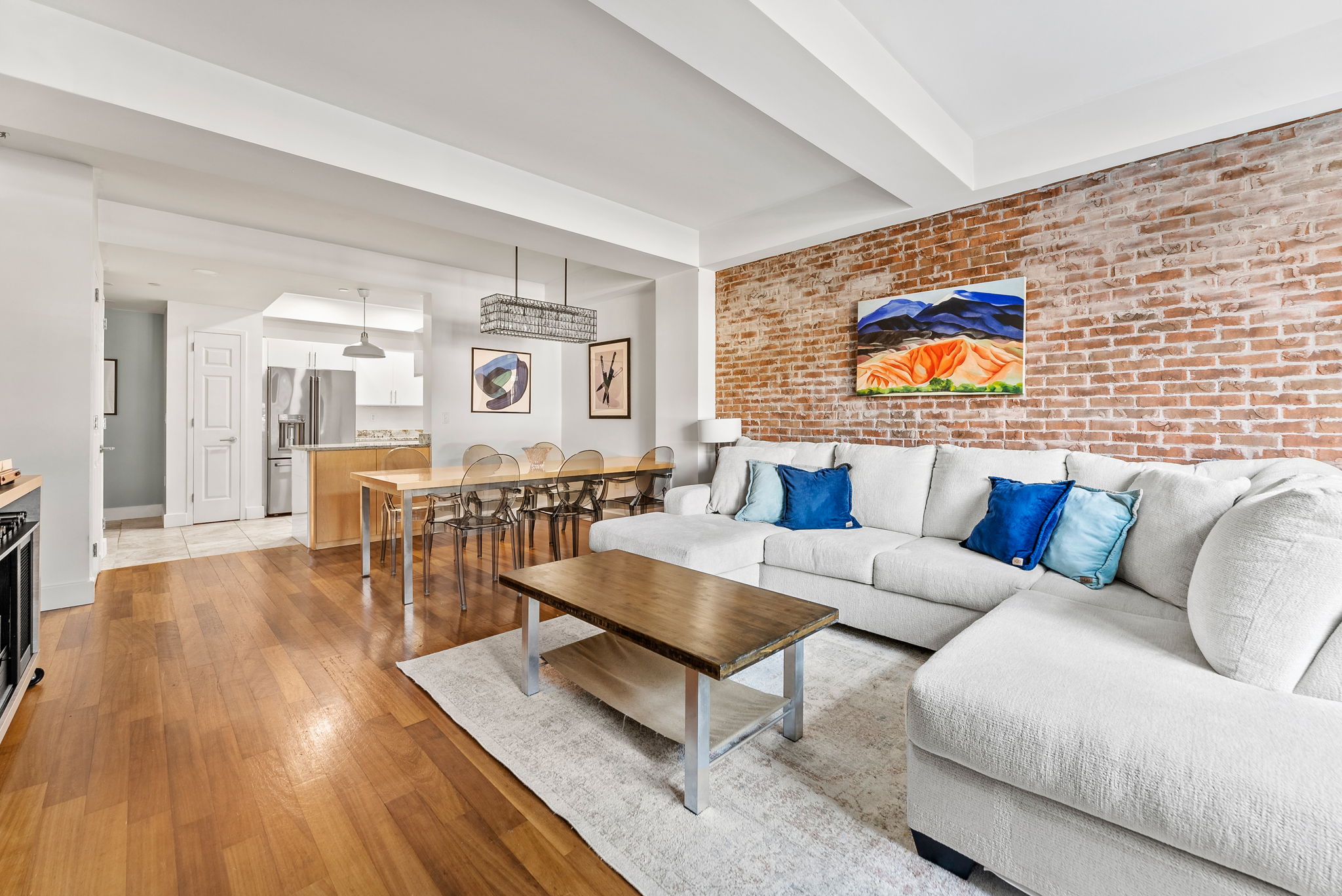 106 West 116th Street, Unit 2A Manhattan, NY 10026 - Photo 3 of 16 a living room with furniture and wooden floor