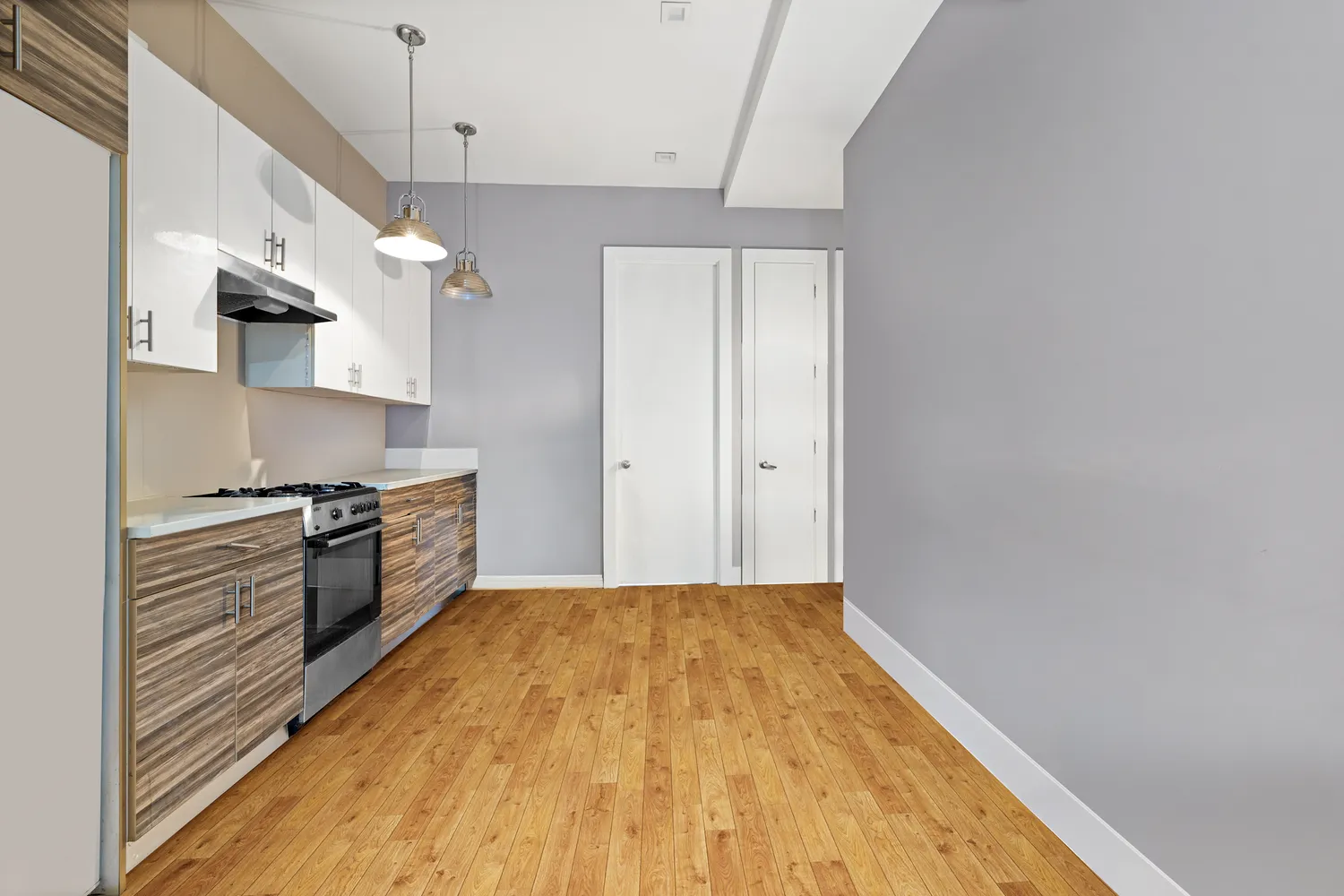 a kitchen with stainless steel appliances a stove and a refrigerator