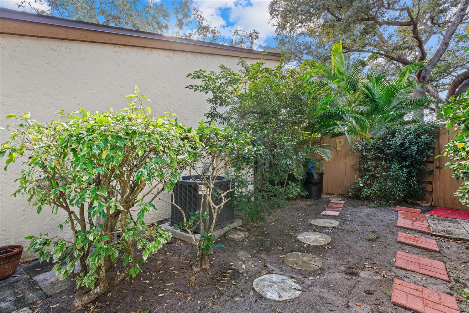 a view of a house with a tree s