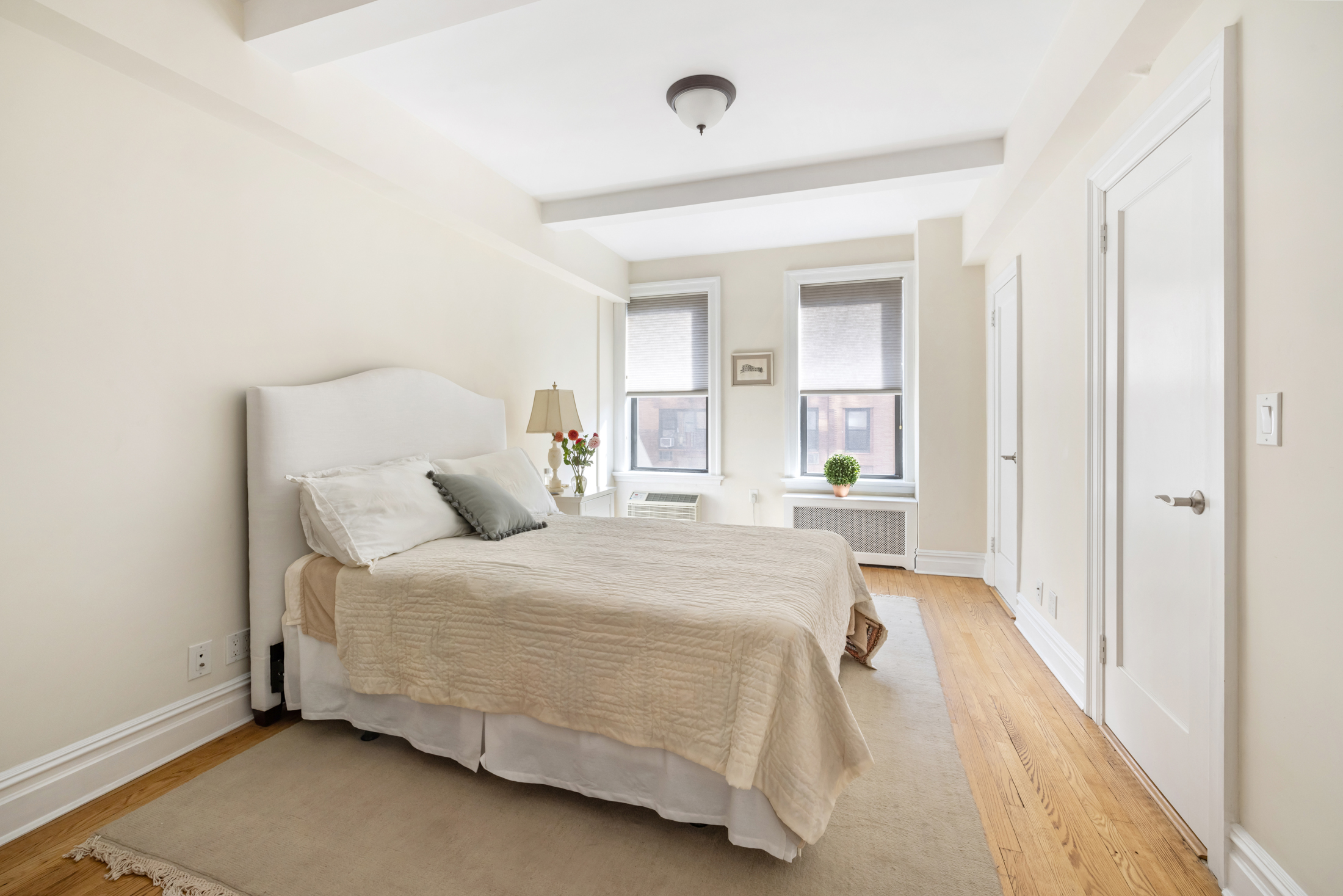 444 Central Park West, Unit 5E Manhattan, NY 10025 - Photo 10 of 14 a bedroom with a bed and a window