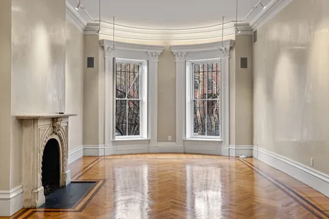 a view of livingroom with furniture and a window
