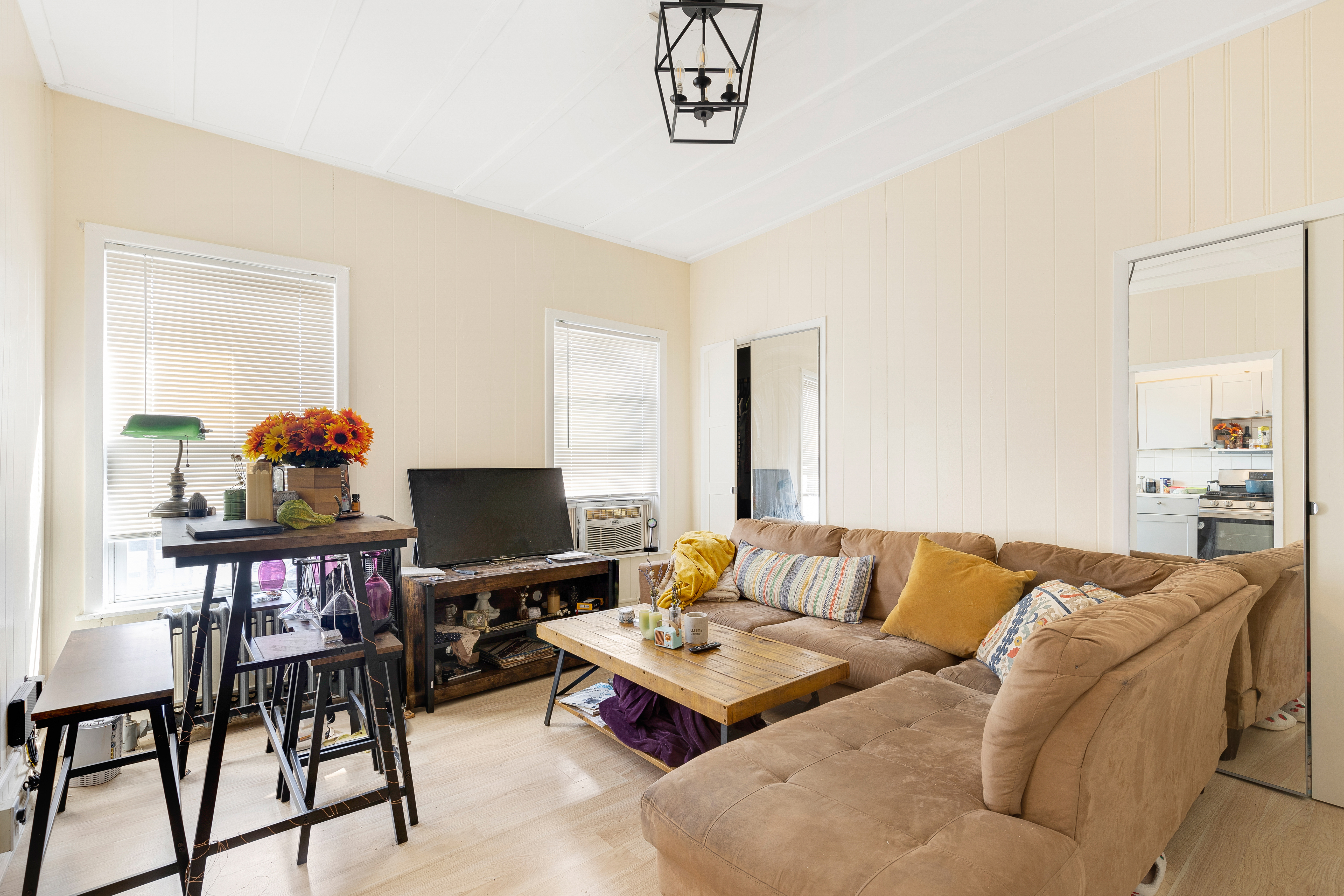 35-47 30th Street Queens, NY 11106 - Photo 9 of 14 a living room with furniture and a flat screen tv