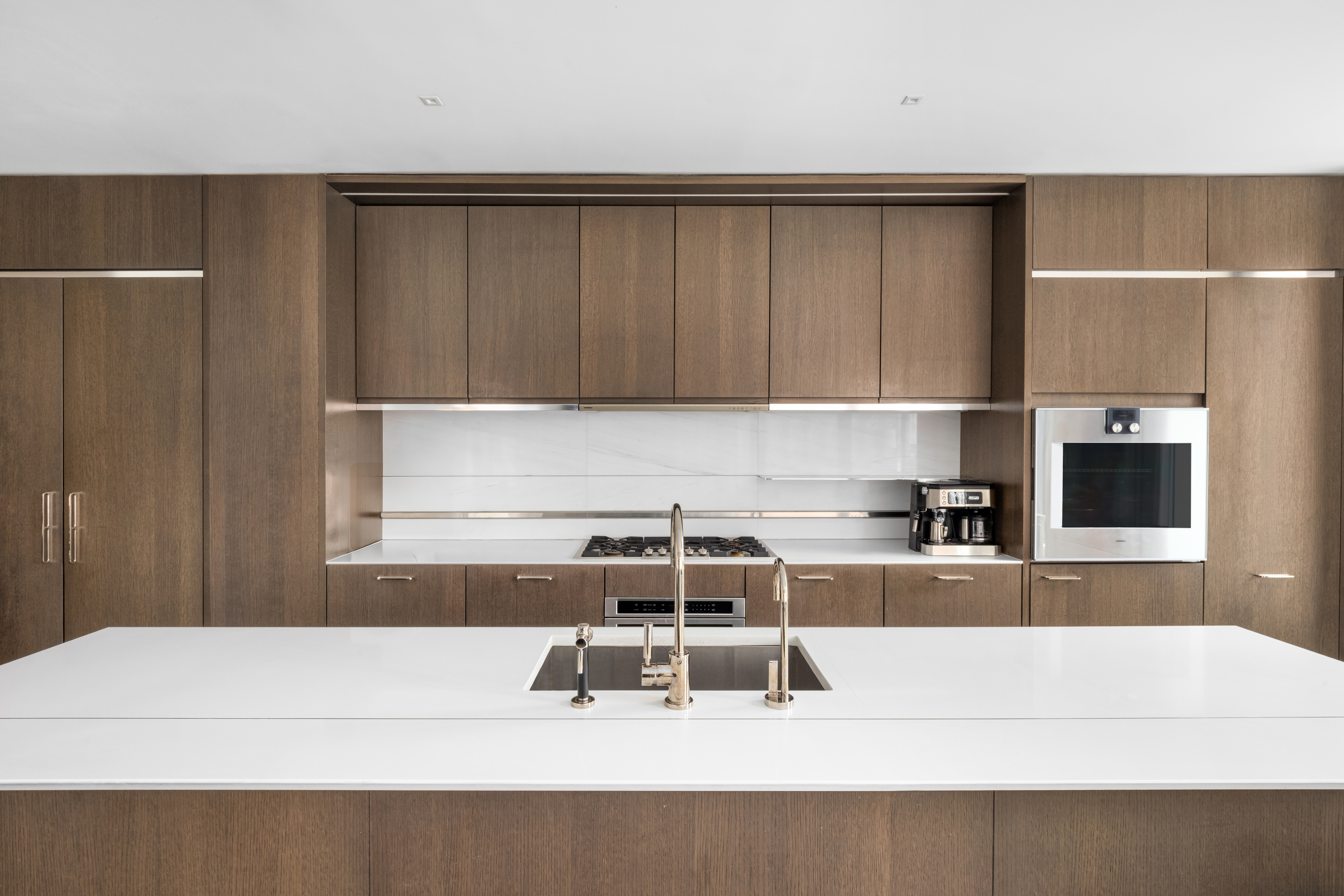 301 East 50th Street, Unit 8C Manhattan, NY 10022 - Photo 5 of 20 a kitchen with a sink and cabinets