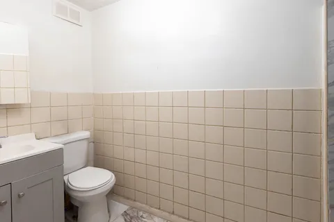 a bathroom with a toilet and a sink