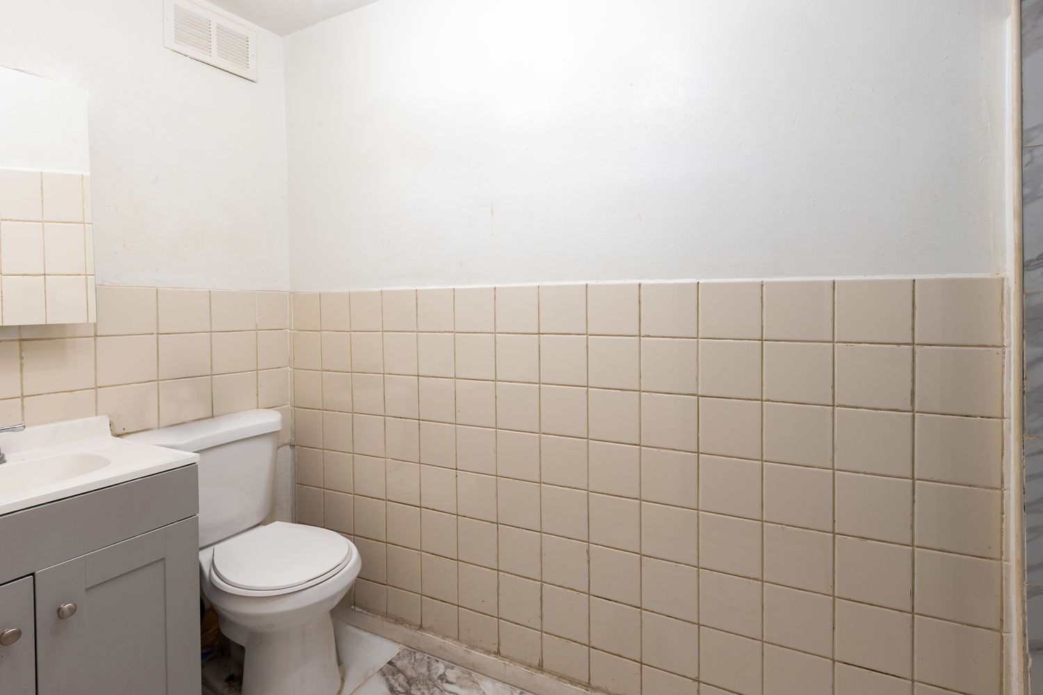 297 Pennsylvania Avenue Brooklyn, NY 11207 - Photo 8 of 9 a bathroom with a toilet and a sink