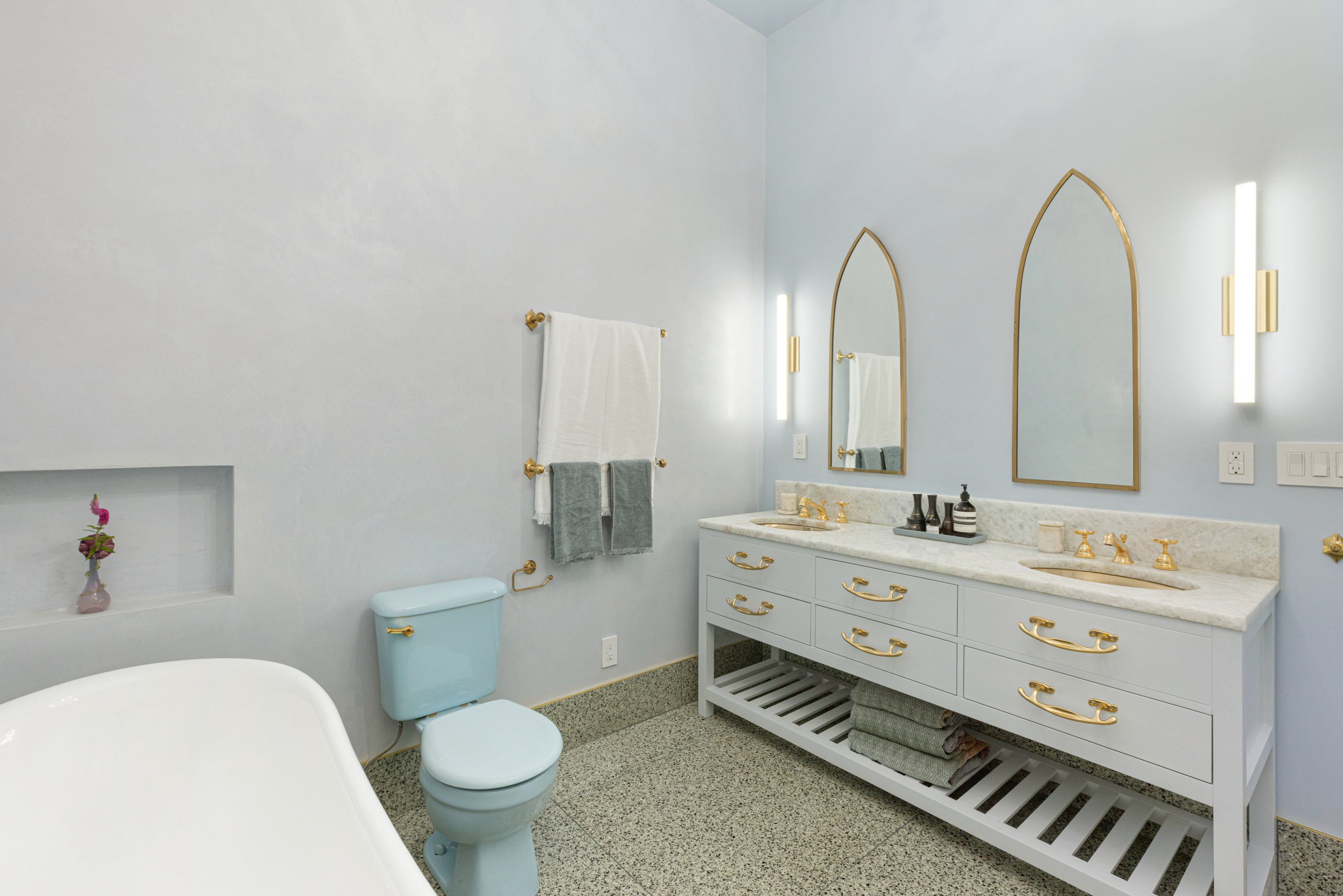 55 Walker Street, Unit 3A Manhattan, NY 10013 - Photo 9 of 12 a spacious bathroom with a double vanity sink toilet and a mirror